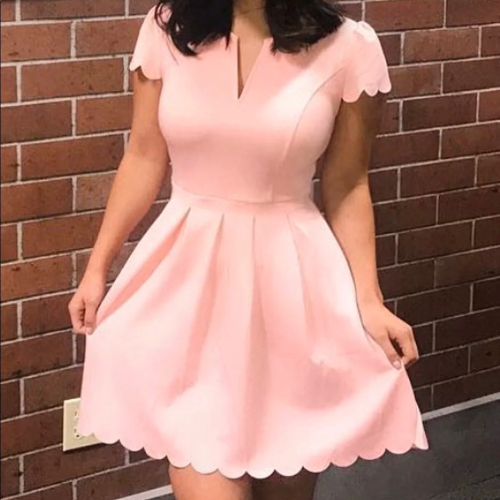 Pink dress with scalloped detail